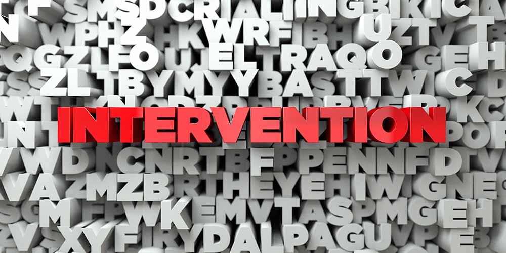 A graphic of jumble of white letters with the word 'Intervention' in red in the center.