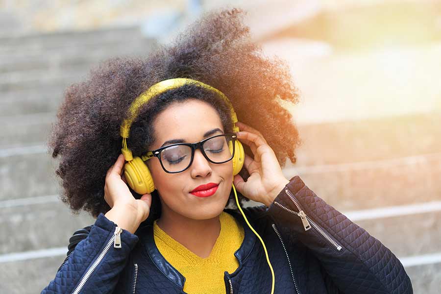 woman with headphones listening to music