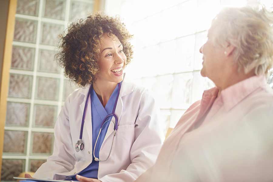 doctor talking to a senior woman