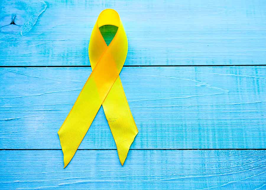 Yellow ribbon on a blue wall