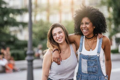 : two women with their arms around each other
