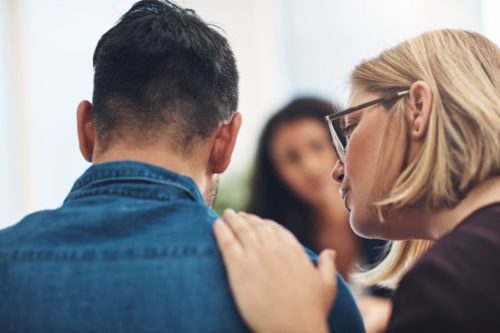 Professional couple engaged in office discussion