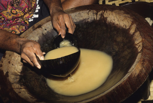 A close up of a local man making a bowl of kava.