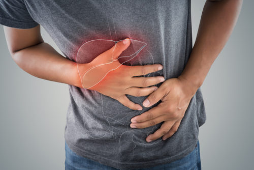 Man experiencing stomach pain discomfort