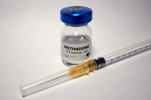 Syringe with needle and methadone vial
