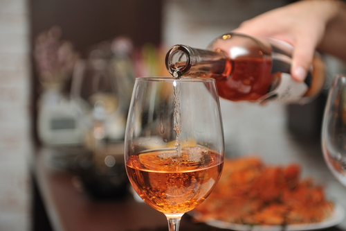 Wine being poured into a glass.