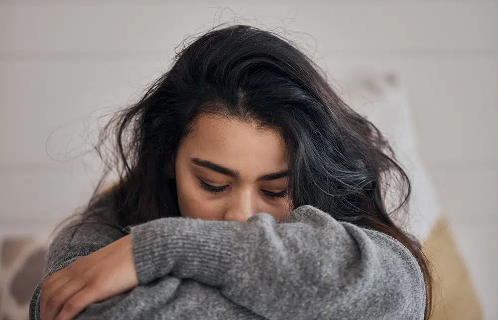 Girl with her head down