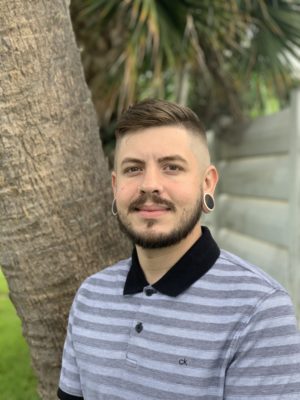 A headshot of Justin Conroy, an admissions counselor at Beach House Recovery Center.