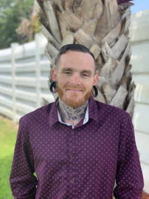 A headshot of Justin Epstein, an admissions counselor at Beach House Recovery Center.