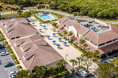 Aerial view of Beach House Recovery Center on a sunny day.
