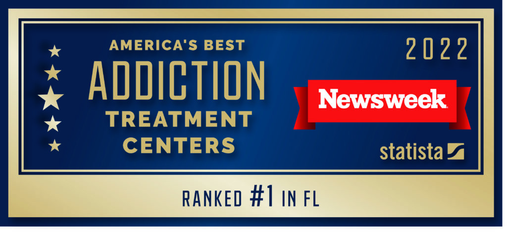 A blue and gold Newsweek graphic stating 'America's Best Addiction Treatment Center' for 2022