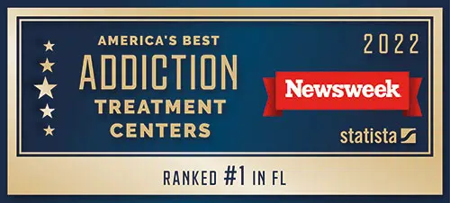 A blue and gold graphic of stating 'America's best treatment centers 2022 - Ranked #1 in Florida' by Newsweek and Statista