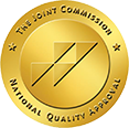 A gold graphic for The Joint Commision providing National Quality Approval to Beach House Recovery Center.