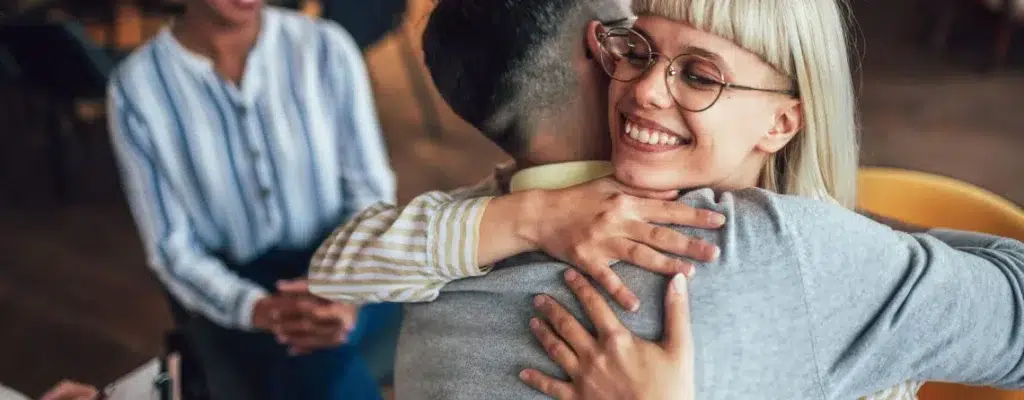 Couple shares a warm hug at dinner