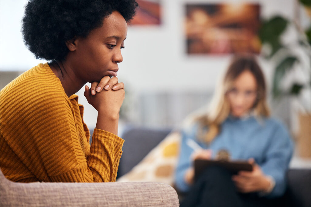 Woman sitting with therapist