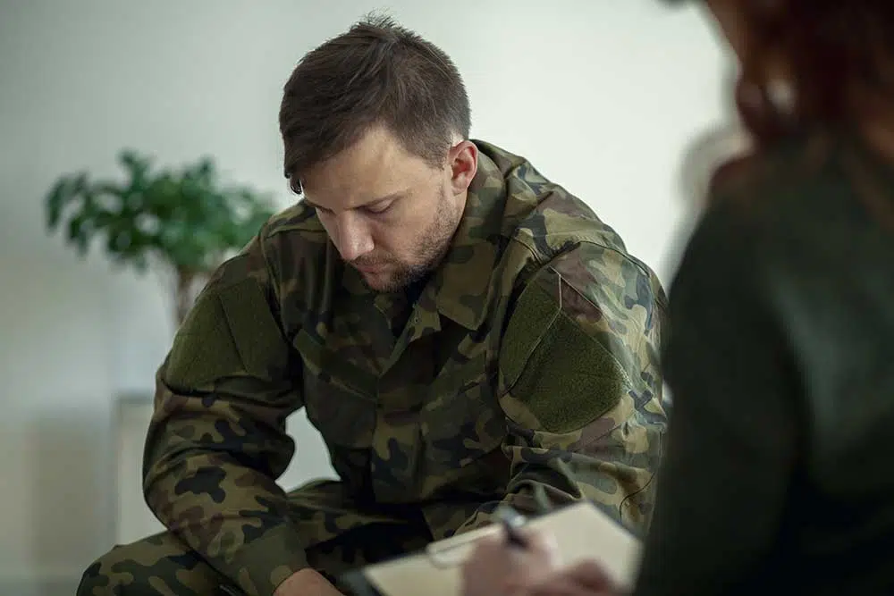 Man in fatigues with therapist