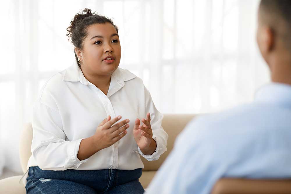 Woman speaking with therapist