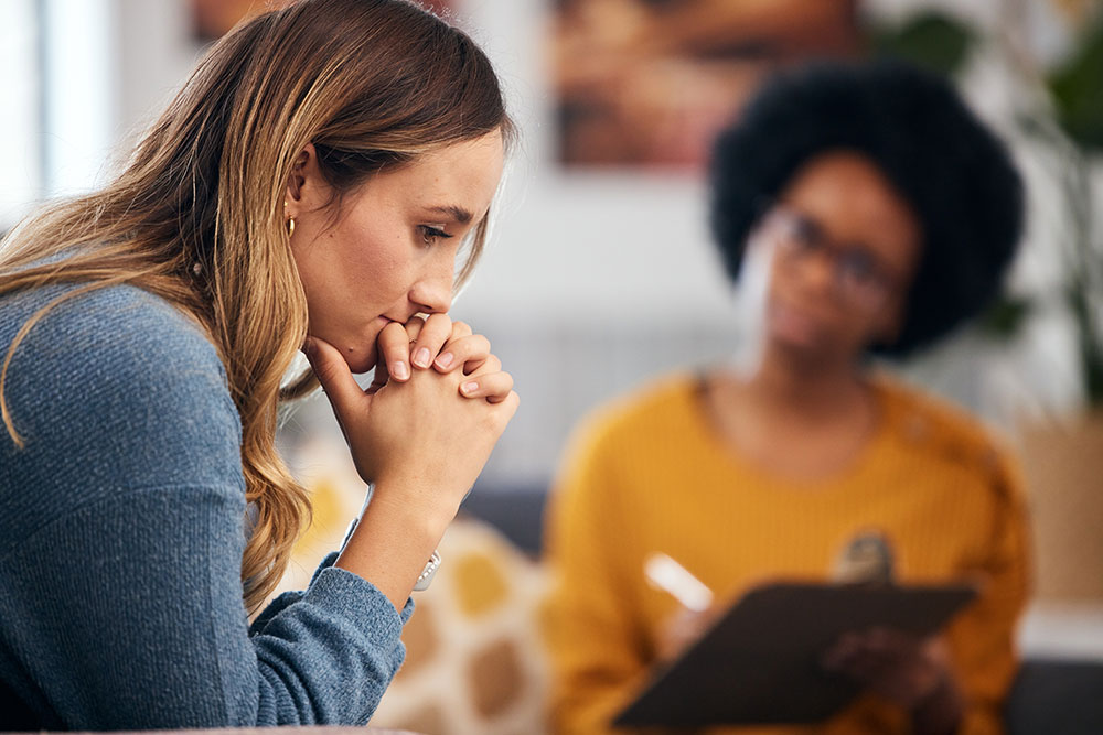 Woman thinking while with therapist