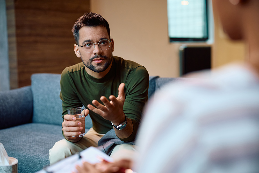 Man speaking with therapist