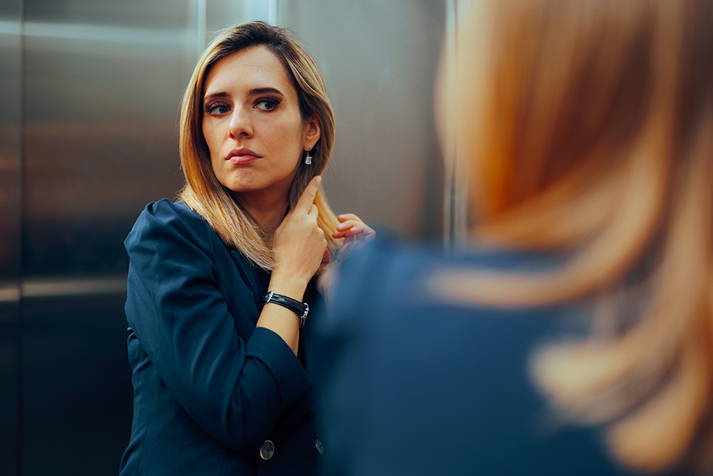 Woman looking at herself