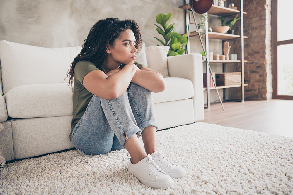 woman sitting alone on the floor